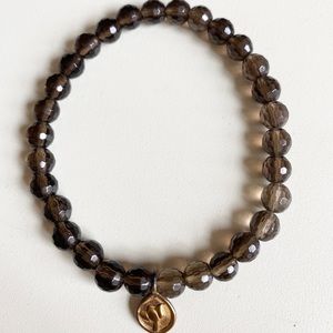 Satya bracelet, like new. Smoky quartz, lotus